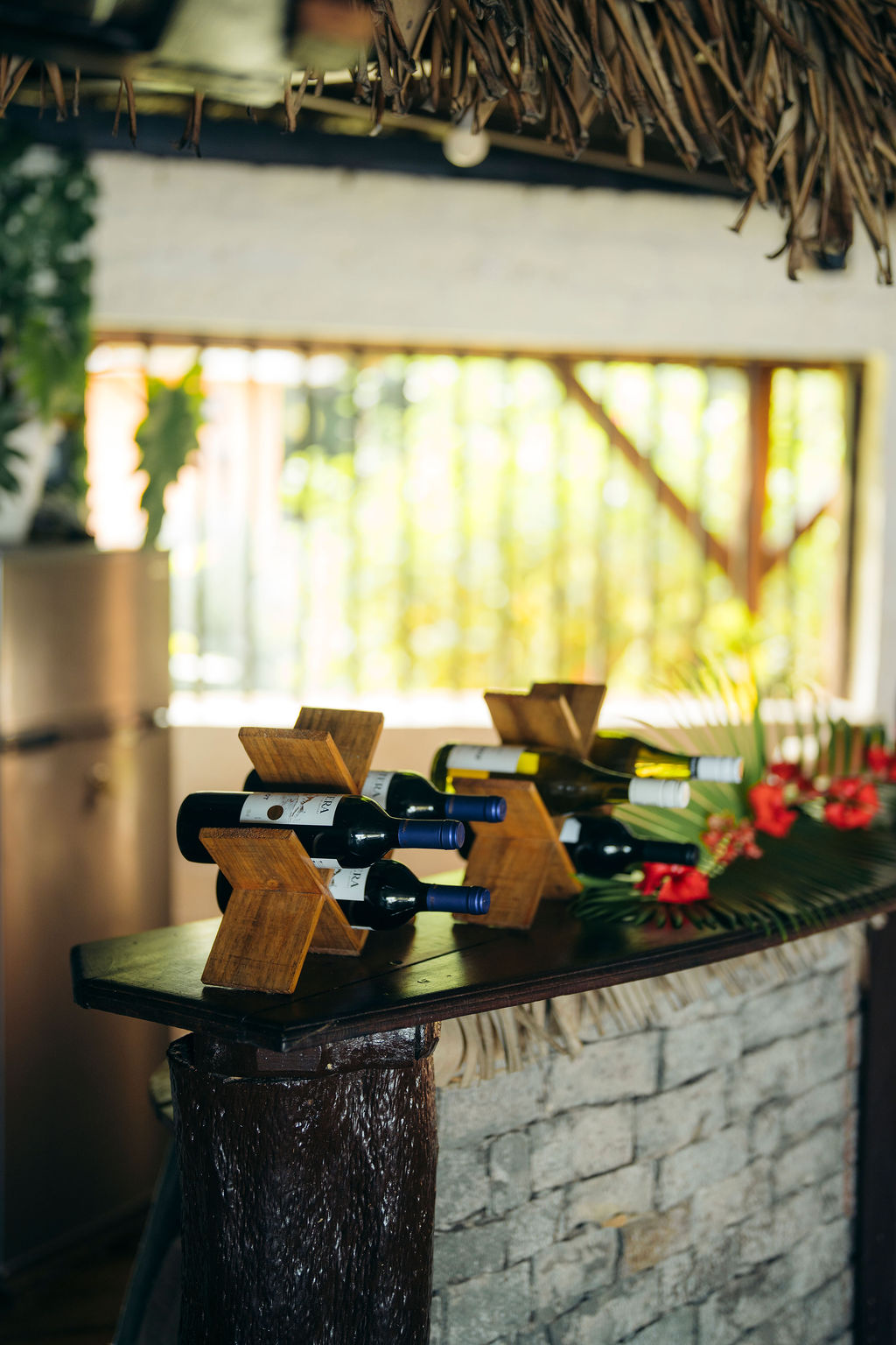 The bar and wine rack at Aurora Bar on Ile aux Nattes